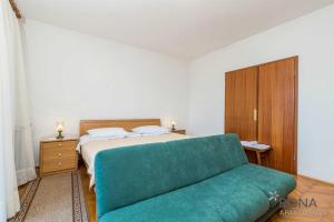 Posteľ alebo postele v izbe v ubytovaní Rona Apartments Ani