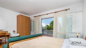 Posteľ alebo postele v izbe v ubytovaní Rona Apartments Ani