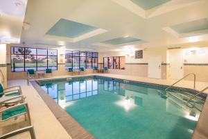 a large swimming pool with blue water at TownePlace Suites by Marriott Minneapolis near Mall of America in Bloomington