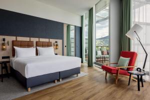 Ένα ή περισσότερα κρεβάτια σε δωμάτιο στο Four Points by Sheraton Panoramahaus Dornbirn +37 φωτογραφίες