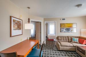 a living room with a table and a couch at TownePlace Suites Cleveland Streetsboro in Streetsboro
