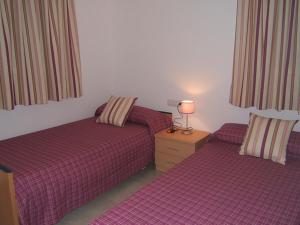 Postel nebo postele na pokoji v ubytování Villa Cala Llobeta 4C-11 + 23 fotografií