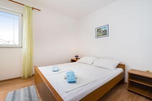Łóżko lub łóżka w pokoju w obiekcie Nice Apartment Silvia