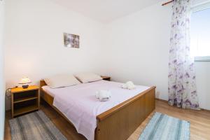 Łóżko lub łóżka w pokoju w obiekcie Nice Apartment Silvia