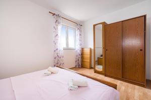 Łóżko lub łóżka w pokoju w obiekcie Nice Apartment Silvia