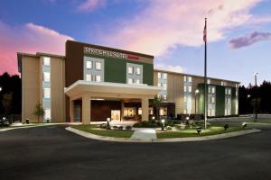 a building with a flag in front of it at SpringHill Suites by Marriott Mobile West in Mobile