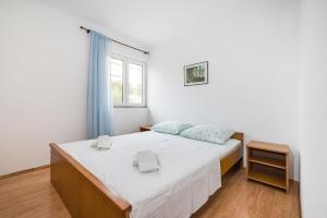 Łóżko lub łóżka w pokoju w obiekcie Nice Apartment Silvia
