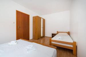 Łóżko lub łóżka w pokoju w obiekcie Nice Apartment Silvia