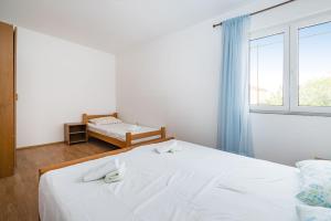Łóżko lub łóżka w pokoju w obiekcie Nice Apartment Silvia