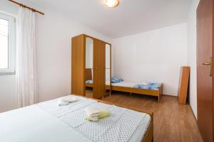 Łóżko lub łóżka w pokoju w obiekcie Nice Apartment Silvia