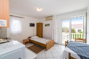 Łóżko lub łóżka w pokoju w obiekcie Nice Apartment Silvia