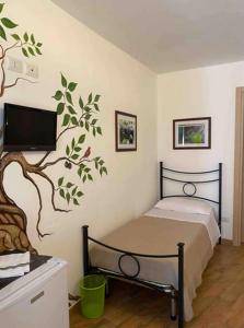 Posteľ alebo postele v izbe v ubytovaní Antico Borgo - A due passi dalle Gole Alcantara