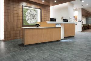 an office lobby with a reception desk and tile floors at Fairfield by Marriott Inn & Suites Dallas McKinney in McKinney