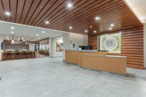 a lobby of a hospital with wooden ceilings and a reception desk at Fairfield Inn & Suites Franklin in Franklin