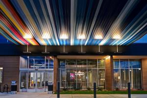 a building with a rainbow ceiling at Aloft Mooresville in Mooresville