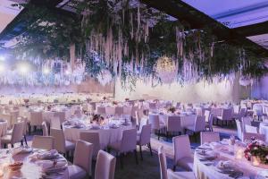 a banquet hall with white tables and chairs at The Abu Dhabi EDITION in Abu Dhabi +56 photos