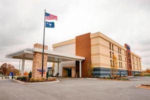 an office building with an american flag in front of it at Fairfield Inn & Suites by Marriott Greenville Simpsonville in Simpsonville