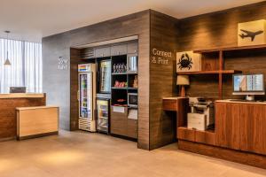 a restaurant with a refrigerator and a counter with drinks at Fairfield Inn & Suites by Marriott Mexico City Vallejo in Mexico City