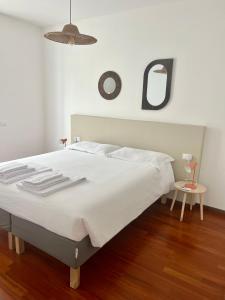 A bed or beds in a room at terrazza e giardino apartment