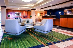 a living room with two chairs and a couch at Fairfield Inn and Suites by Marriott Indianapolis/ Noblesville in Noblesville