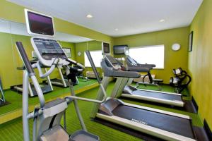 a gym with treadmill and ellipticals in a room at Fairfield Inn & Suites by Marriott Memphis East Galleria in Memphis