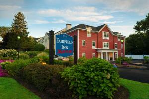 a sign in front of a red building with a law office at Fairfield Inn by Marriott Boston Sudbury in Sudbury