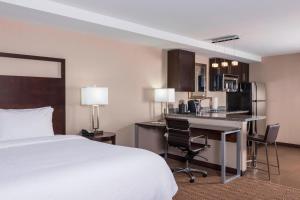 a hotel room with a bed and a kitchen at Fairfield Inn by Marriott Boston Sudbury in Sudbury