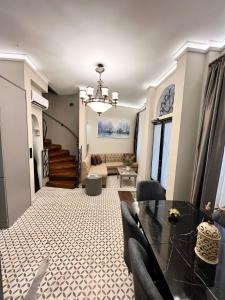 a living room with a table and a couch at The House Company in Istanbul