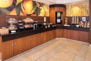 a kitchen with a counter with some food on it at Fairfield Inn and Suites by Marriott San Antonio Northeast / Schertz / RAFB in Schertz