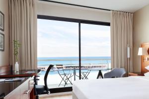 a hotel room with a view of the ocean at Riviera Marriott Hotel La Porte De Monaco in Cap d'Ail