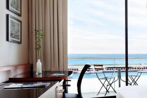a hotel room with a view of the ocean at Riviera Marriott Hotel La Porte De Monaco in Cap d'Ail