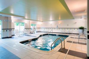 a swimming pool in a hotel lobby at Fairfield Inn & Suites Huntingdon Raystown Lake in Huntingdon