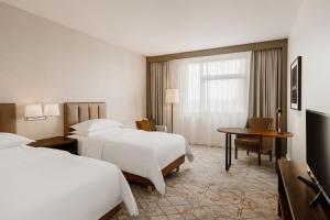 Posteľ alebo postele v izbe v ubytovaní Sheraton Poznan Hotel