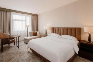 Posteľ alebo postele v izbe v ubytovaní Sheraton Poznan Hotel