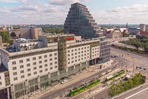 an aerial view of a city with a tall building at Sheraton Poznan Hotel in Poznań