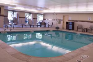 a large swimming pool in a hotel room at Courtyard by Marriott Colorado Springs South in Colorado Springs