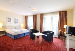 Postel nebo postele na pokoji v ubytování Morada Hotel Gothaer Hof + 8 fotografií