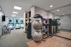 a fitness room with a bunch of equipment in it at Fairfield by Marriott Inn & Suites Mansfield in Mansfield