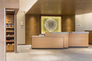a lobby with a reception desk in a building at Fairfield Inn & Suites by Marriott Des Moines Downtown in Des Moines