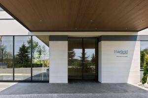 an entrance to a building with a sign on it at Fairfield by Marriott Hokkaido Naganuma in Naganuma