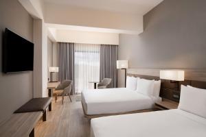 Voodi või voodid majutusasutuse AC Hotel by Marriott Punta Cana toas