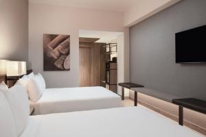 Voodi või voodid majutusasutuse AC Hotel by Marriott Punta Cana toas