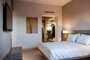 Voodi või voodid majutusasutuse AC Hotel by Marriott Punta Cana toas
