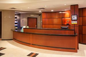 a lobby of a hospital with a reception counter at Courtyard Louisville Northeast in Louisville