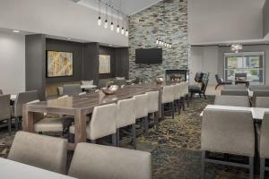 a conference room with a long table and chairs at Residence Inn by Marriott Phoenix Airport in Phoenix
