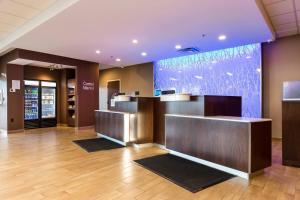 a lobby with a reception desk in a building at Fairfield Inn & Suites by Marriott Edmonton North in Edmonton