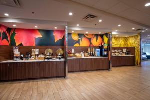 a restaurant with a buffetasteryasteryasteryasteryasteryasteryasteryasteryasteryasteryastery at Fairfield Inn & Suites by Marriott Edmonton North in Edmonton