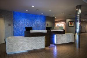 a lobby with a blue wall in a hospital at Fairfield Inn & Suites by Marriott Moscow in Moscow