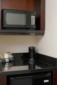 a microwave sitting on a counter in a hotel room at Fairfield Inn & Suites San Diego Old Town in San Diego