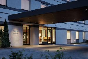 a large building with a lot of windows at Fairfield by Marriott Hokkaido Minamifurano in Minamifurano